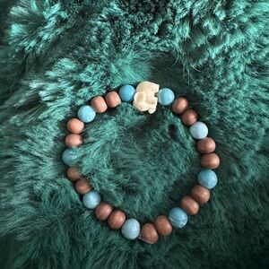 Wood and Larimar beaded bracelet with a Quartzite elephant